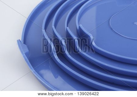 glass food container with blue plastic lid isolated on white background.