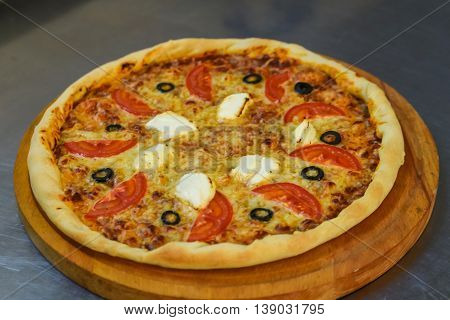 Classic homemade Italiancheese pizza just out of the oven