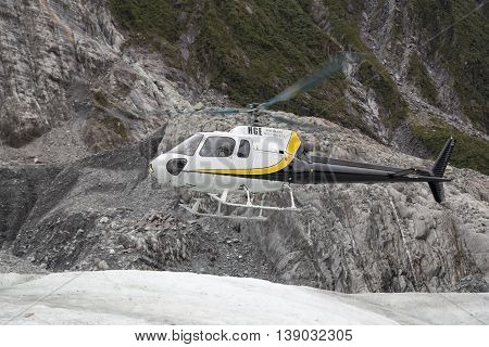 Franz Josef Glacier, New Zealand - March 22, 2015: A Helicopter landing on Franz Josef Glacier