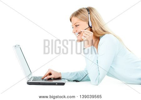 Young woman is using laptop. Isolated on white.
