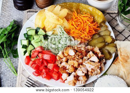 shawarma still life on a plate on top of meat chicken cabbage carrot onion pepper still life