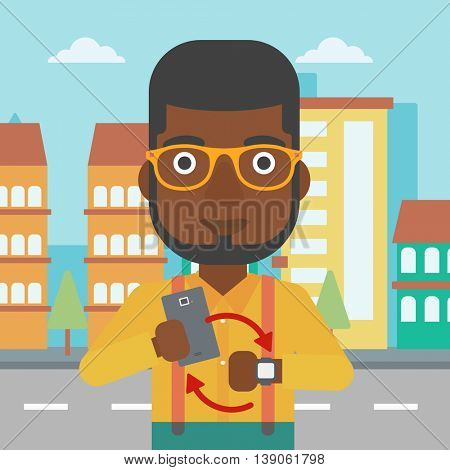 An african-american man holding smartphone and looking at his smart watch. Synchronization between smartwatch and smartphone. Vector flat design illustration. Square layout.
