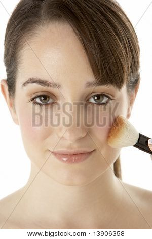 Teenage Girl Applying Make Up