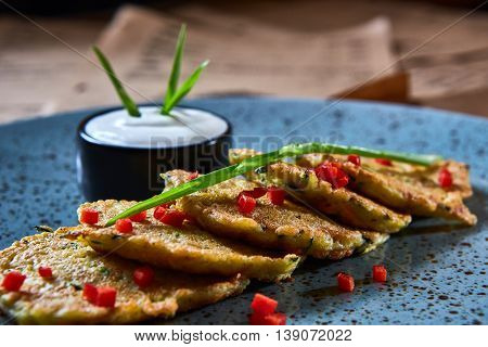 Vegan potato pancakes with sour soy cream