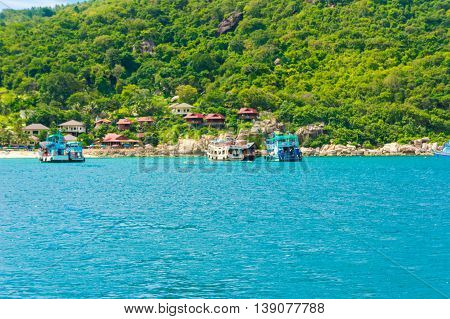 Sea With Rock Mountain Blues Sky Background