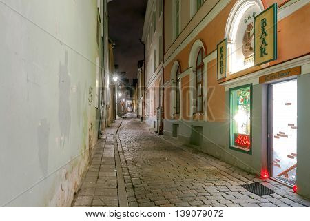 Tallinn Estonia - October 18 2015: Traditional narrow streets in the historical part of Tallinn. Sights of the city included in the UNESCO World Heritage List.