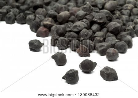 Heap of black Ceci neri chickpeas on white background