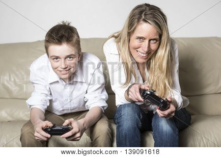 A mother and child playing a video game