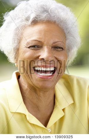 Portrait Of Smiling Senior Woman Outdoors