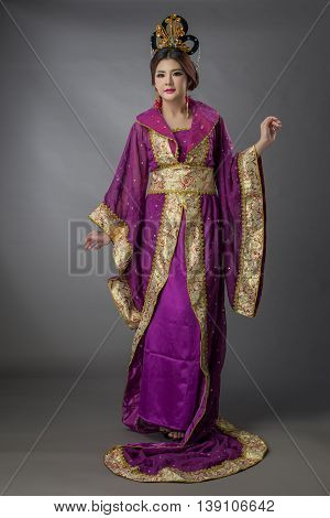 Beautiful Asian Model Young Asia Oriental Woman Wearing Chinese Qipao Dress - Studio Shot