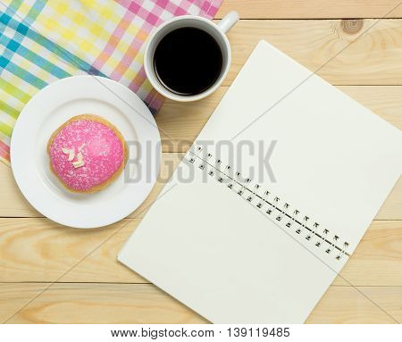 Blank notebook page for recipe on cafe table pastel tone.