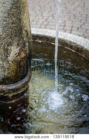 Splashed Water Drops In A Stone Standpipe