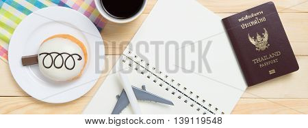 Travel blogger Planning book on cafe table banner