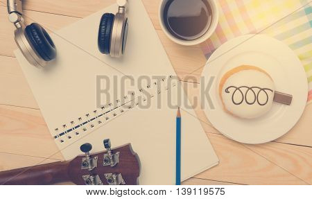 Music Writing equipment with coffee break relaxation.