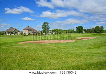 BROMONT QUEBEC CANADA 06 14 2016: Designed in 1992 by famous Graham Cooke, The Royal Bromont Golf Club offers an exceptional view of the surrounding mountains right in the heart of the City of Bromont
