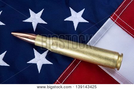50 caliber brass bullet on American flag with room for your type..