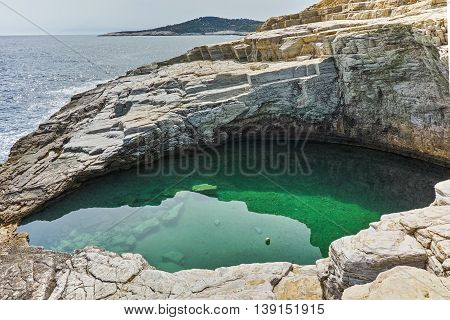 Green waters of Giola Natural Pool in Thassos island, East Macedonia and Thrace, Greece