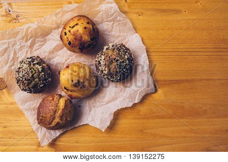 Homemade salty muffins also called proja pie traditional Balkans baked food with savory cheese ham eggs and paprika made of corn flour starch top view selective focus.