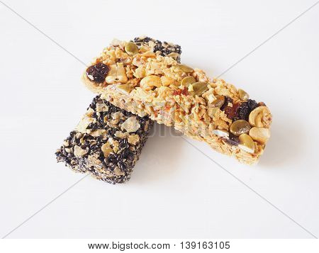 Healthy granola. Organic munchies bars on white background.