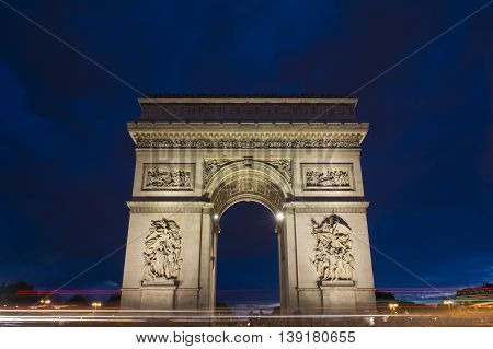 The Arch of Triumph at dusk with light trails Paris France