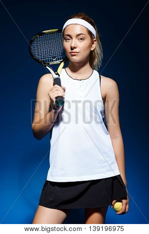 Picture of young fintess girl holding tennis racket