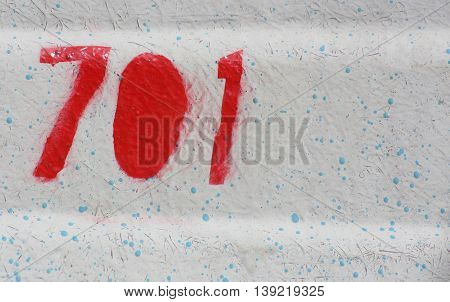 Number 701 painted on the outside of a boat.
