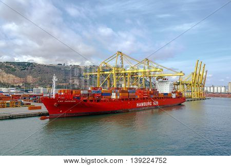 Barcelona Spain - September 26 2015: A container ships are standing in Barcelona port. It is Catalonia's largest port with a trade volume of 2.57 million TEU's.