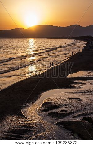 sunset on the beach of Sperlonga with the Circeo promontory in the background Italy