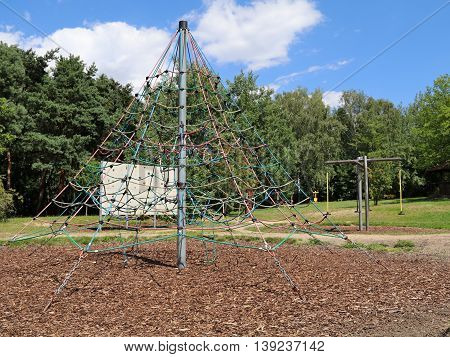 Playground in a city park with benches