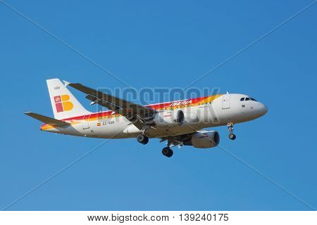 ZURICH - JULY 18: Iberia A-319 landing in Zurich airport after intercontinental flight on July 18, 2015 in Zurich, Switzerland. Zurich airport is one of the biggest european hubs.