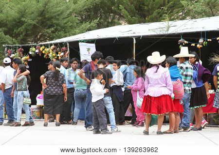 Magdalena Cajamarca Peru - July 17 2016: Peruvian families attend a town festival in Magdalena Cajamarca Peru on July 17 2016