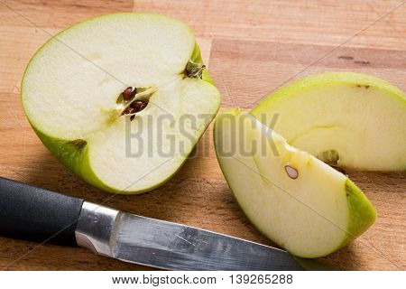 Green Granny Smith Apples on a Wood Cutting Board