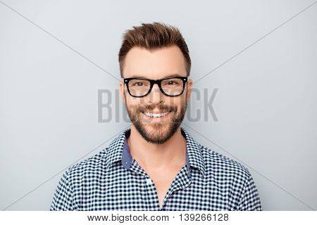 Portrait Of Handsome Cheerful Young Smiling Man In Glasses