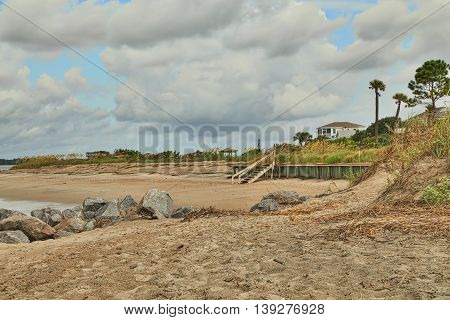 Edisto Beach at low tide shows how beach front along the ocean is divided by jetties making small areas that are less crowded than other beach communities.
