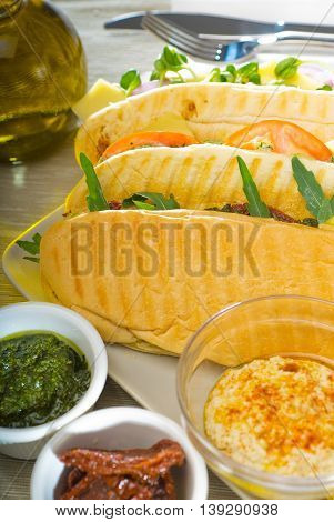 close up image of assorted panini sandwich