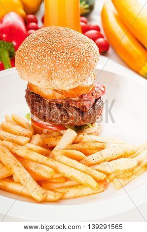 close up image of classic hamburger sandwich and fries