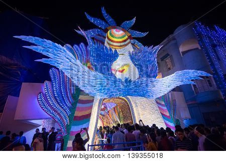 KOLKATA INDIA - OCTOBER 18 2015 : Night image of decorated Durga Puja pandal shot at colored light at Kolkata West Bengal India. Durga Puja is biggest religious festival of Hinduism.