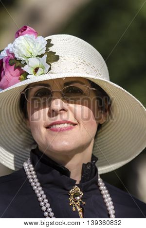 CAGLIARI, ITALY - May 29, 2016: Sunday at La Grande Jatte VIII Ed. At the Public Gardens - Sardinia - portrait of a beautiful woman in Victorian costumes