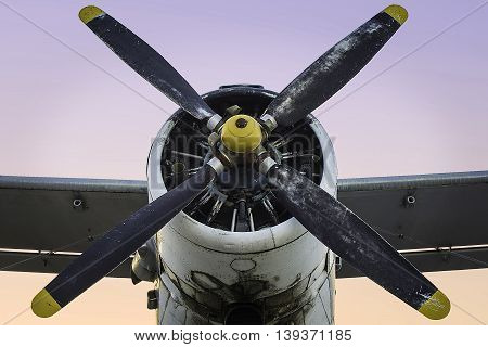 Old single engine propeller airplane at dusk