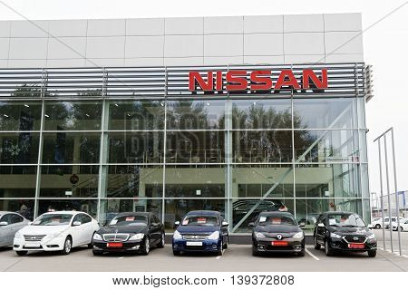 Building Of Nissan Car Selling And Service Center With Nissan Sign.