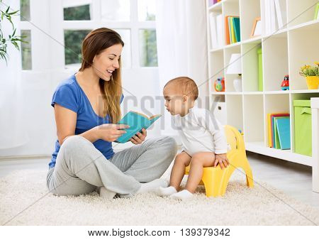 Cute Baby Sitting On Bedpan And Listening Kid Story