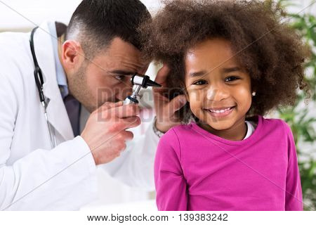Smiling Little African Girl With Ear Specialist