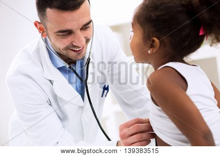 Girl visiting the doctor pediatrician specialist close up