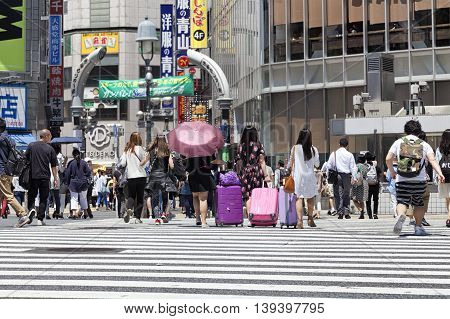 TOKYO, JAPAN - May 18, 2016: Shibuya, It's the shopping district which surrounds Shibuya railway station. This area is known as one of the fashion centers and major nightlife of Japan on May 18, 2016.