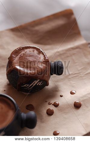 Clay cup with fresh coffee with milk