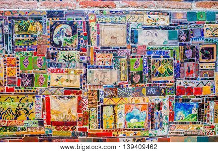 TBILISI GEORGIA - MAY 28 2016: The complex tiled decoration on the wall of the Puppet Theatre clock tower on May 28 in Tbilisi.