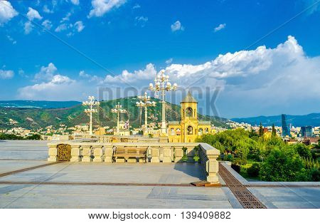 The top of Elia Hill overlooks other hills of Tbilisi and the objects of Sameba Cathedral Complex Georgia.