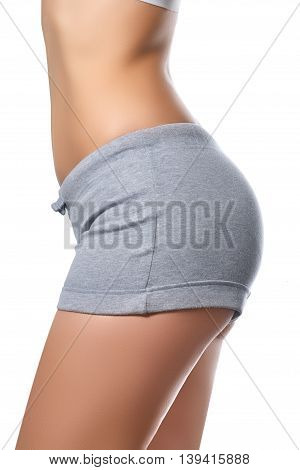 Slim Tanned Woman's Body. Isolated Over White Background