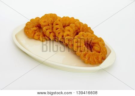 Indian Sweet Imarti or Jhangri arranged in a dish