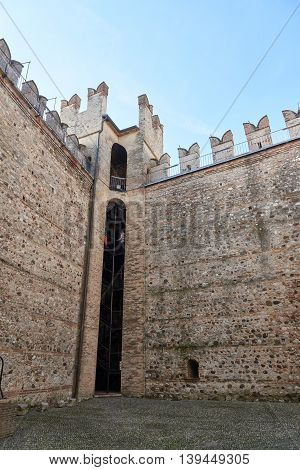 Sirmione Italy - February 21 2016: The Scaliger Castle is a medieval port fortification located at the entrance to the sirmio peninsula which divides the lower part of Lake Garda.